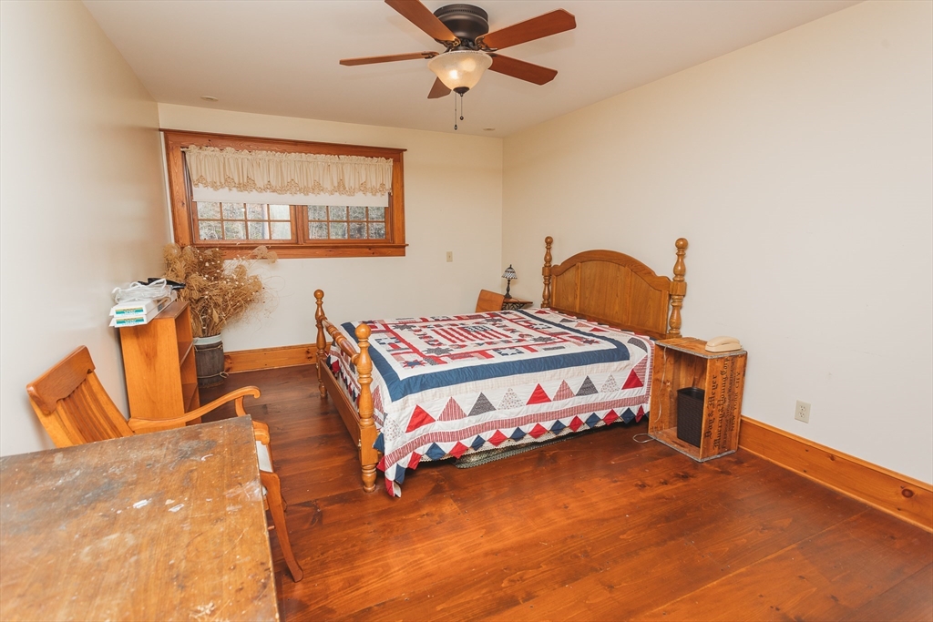 559 Tea Street Charlemont, MA 01339 - Photo 13 of 38 a bedroom with a bed and window