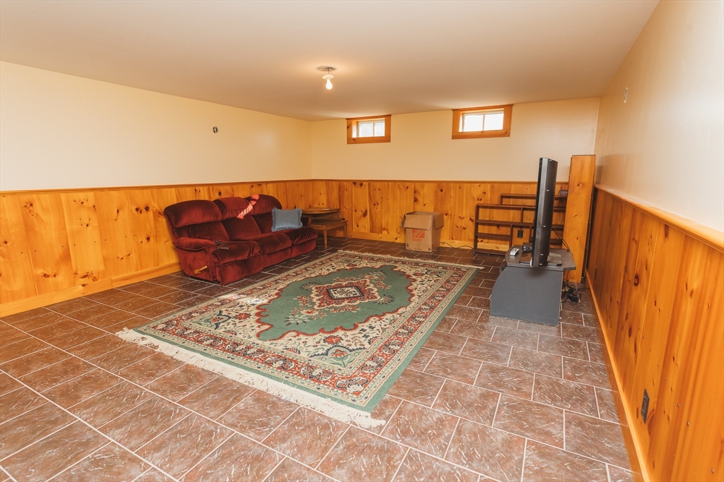 559 Tea Street Charlemont, MA 01339 - Photo 15 of 38 a living room with a rug