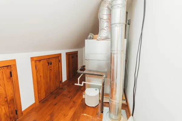 a bathroom with a sink and mirror with toilet