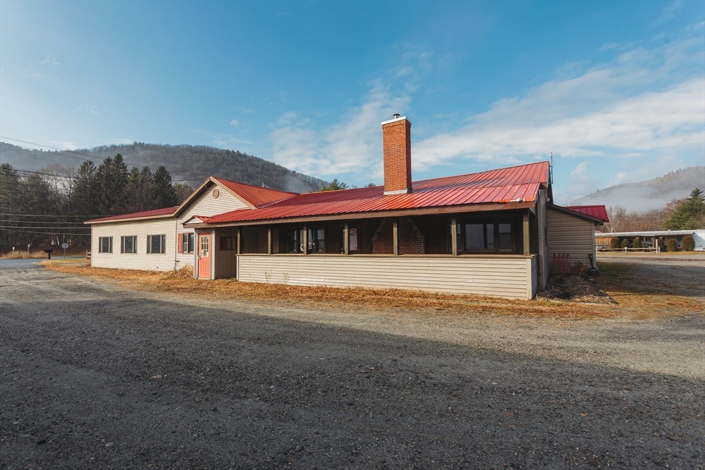 559 Tea Street Charlemont, MA 01339 - Photo 18 of 38 a front view of a house with a yard