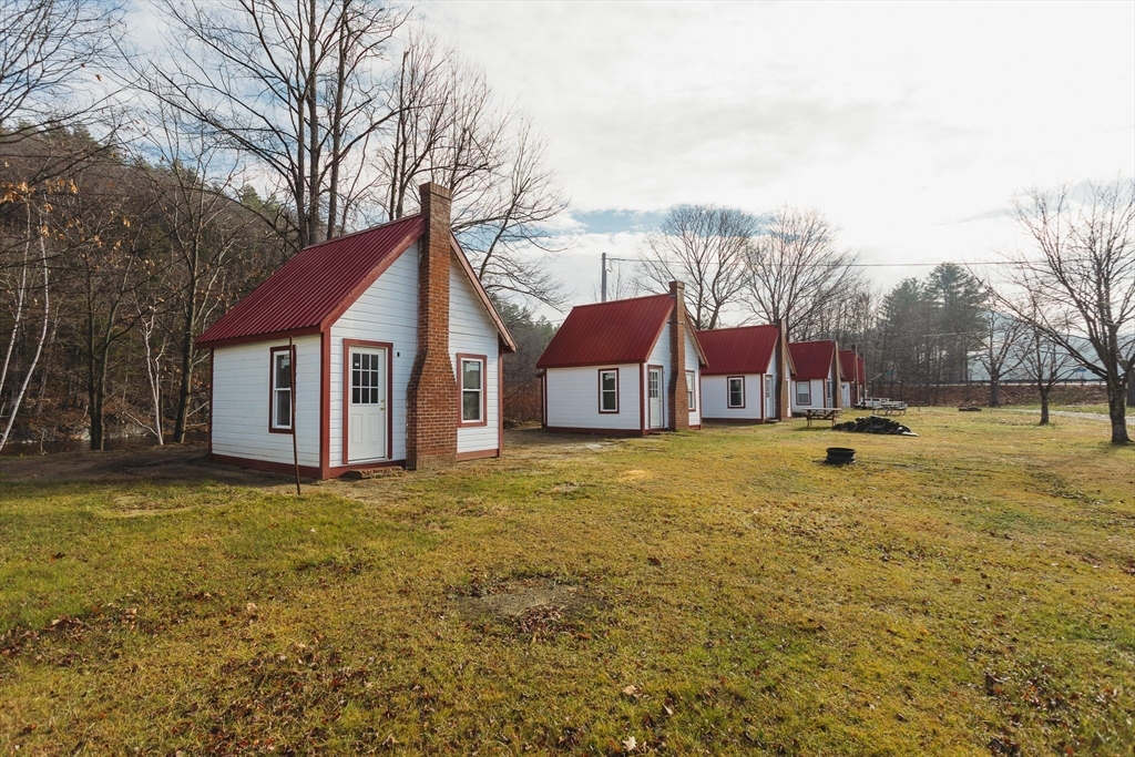 559 Tea Street Charlemont, MA 01339 - Photo 24 of 38 a view of a house with a yard and garage