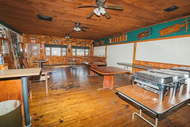 a kitchen with a stove a refrigerator and cabinets