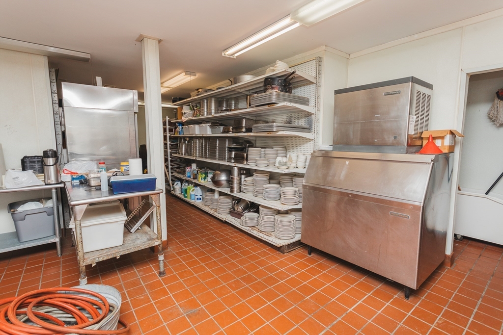559 Tea Street Charlemont, MA 01339 - Photo 29 of 38 a room with wooden cabinets and gym equipment