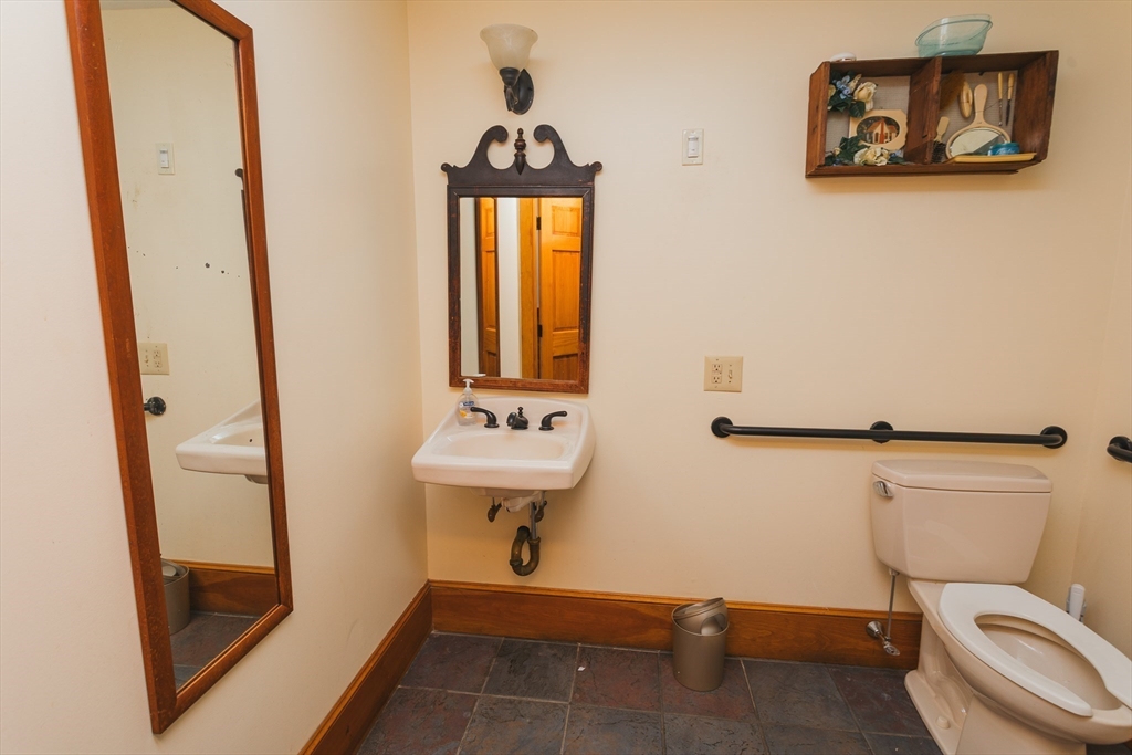 559 Tea Street Charlemont, MA 01339 - Photo 33 of 38 a bathroom with a toilet a sink and mirror