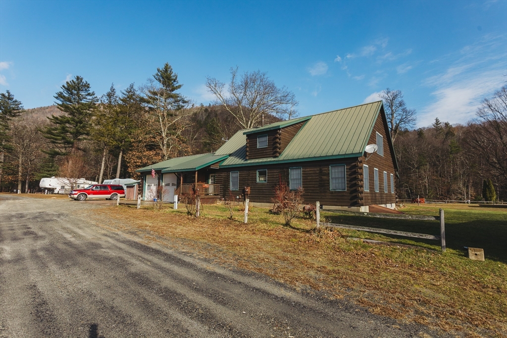 559 Tea Street Charlemont, MA 01339 - Photo 38 of 38 a front view of a house with a yard