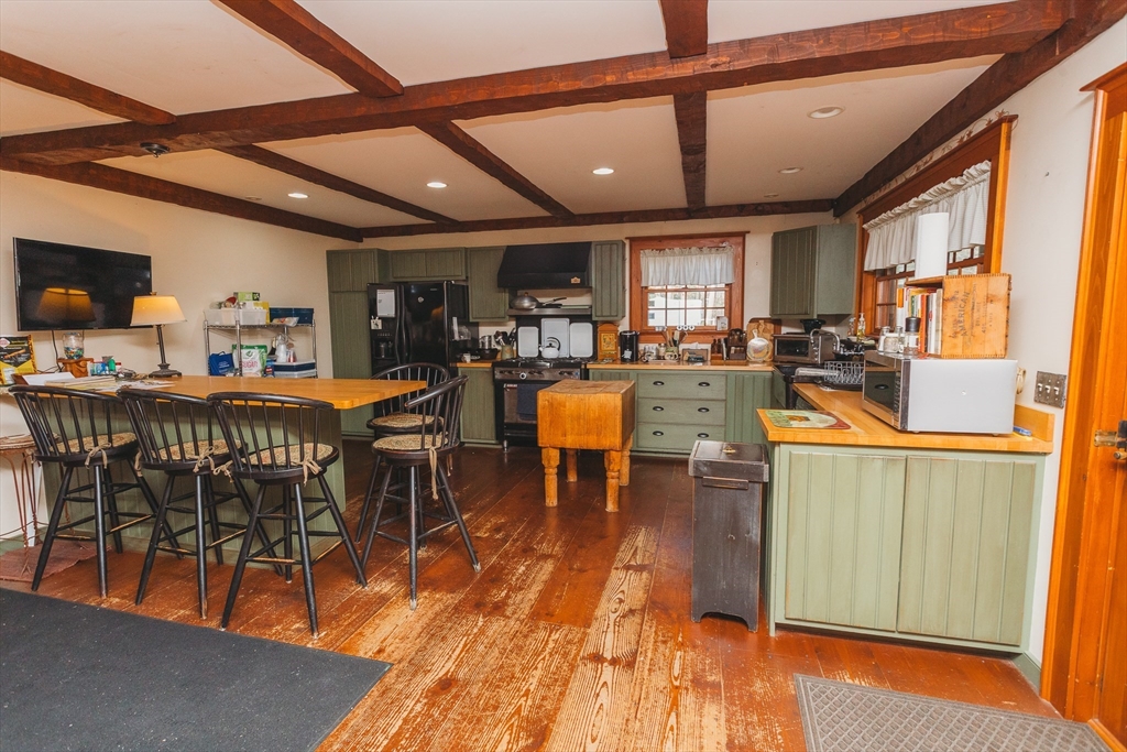 559 Tea Street Charlemont, MA 01339 - Photo 6 of 38 a view of a dining room with furniture window and wooden floor