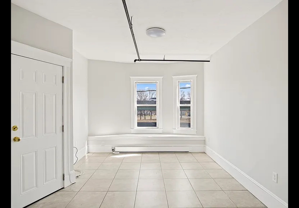 2 Redfield Street, Unit 2 Boston, MA 02122 - Photo 8 of 14 a view of an empty room with a window