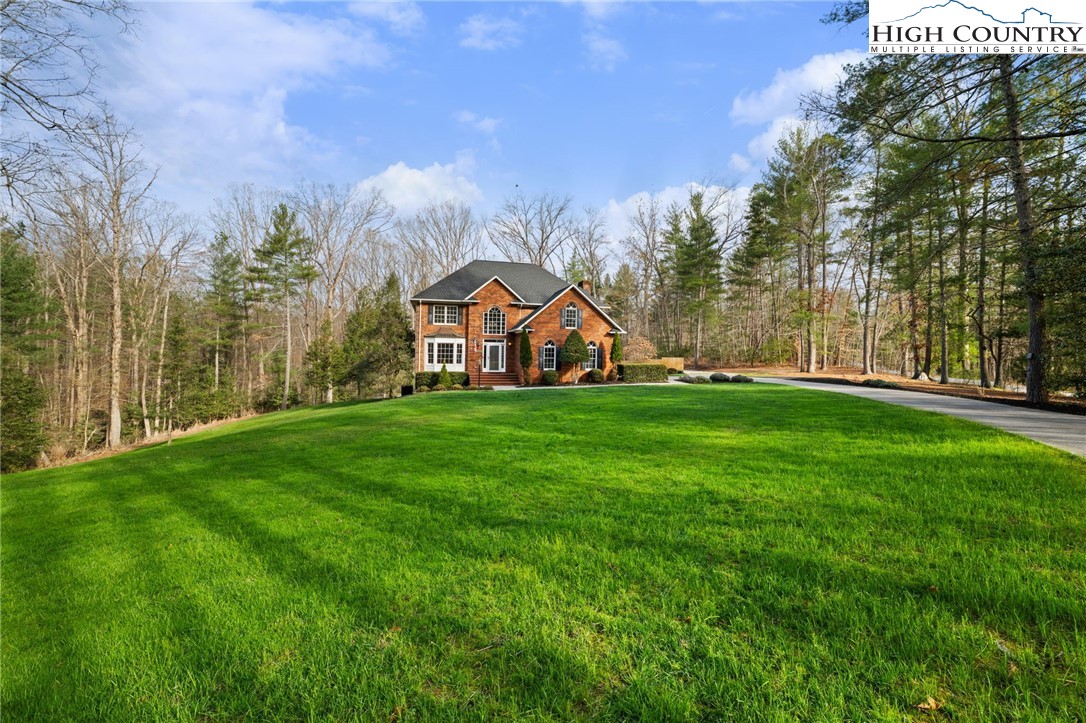 458 Jim Caudill Road Wilkesboro, NC 28697 - Photo 46 of 50 a view of a park that has large trees and a wooden fence