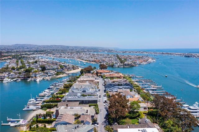 an aerial view of multiple houses with yard