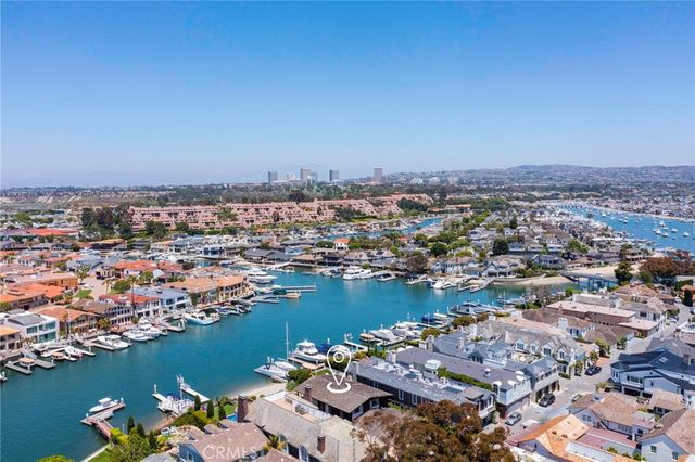 an aerial view of multiple houses with yard