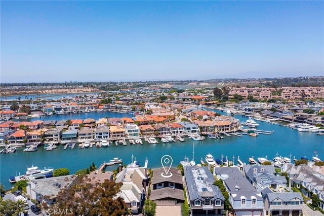 an aerial view of a city with ocean view