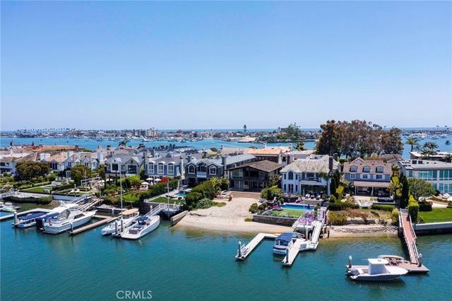 a view of a lake with houses in the back