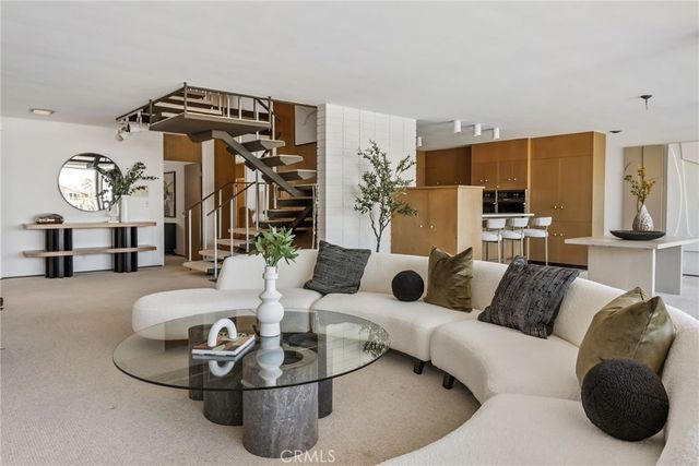 a view of a patio with a table chairs and a potted plant