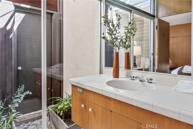 a bathroom with a sink and a mirror