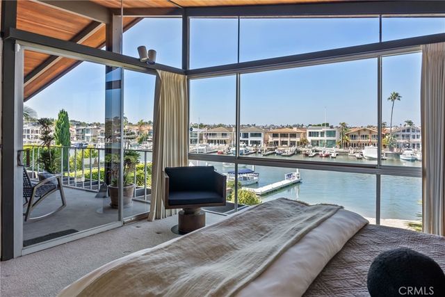 a view of a lake with boats and trees in the background