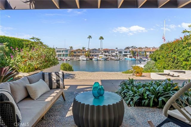 a kitchen with stainless steel appliances kitchen island granite countertop a refrigerator and a stove top oven