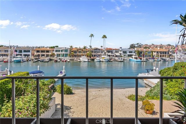 a view of a living room with a floor to ceiling window and floor to ceiling window