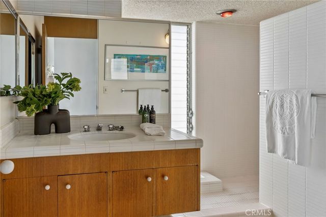 a bed room with a bed and a chair