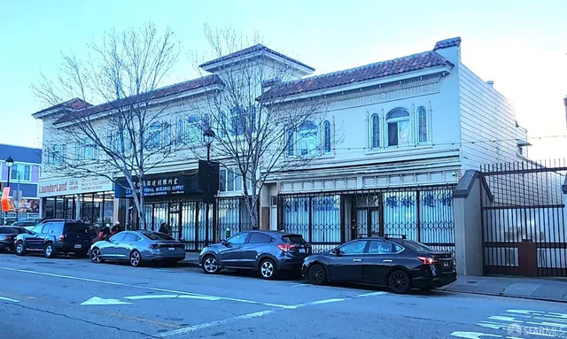 a view of a car parked in front of a building