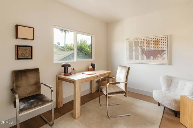 a work room with furniture and windows
