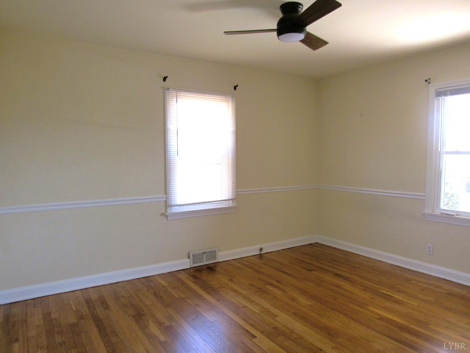 144 Maple Lane Amherst, VA 24521 - Photo 14 of 29 wooden floor in an empty room with a window
