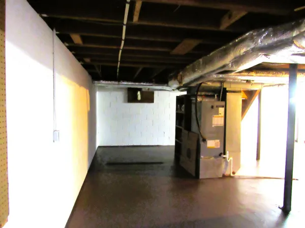 walk in closet with wooden floor