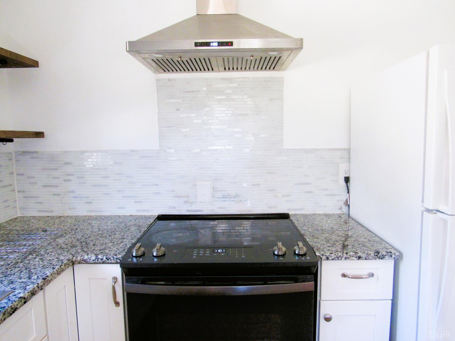 144 Maple Lane Amherst, VA 24521 - Photo 9 of 29 a stove top oven sitting inside of a kitchen