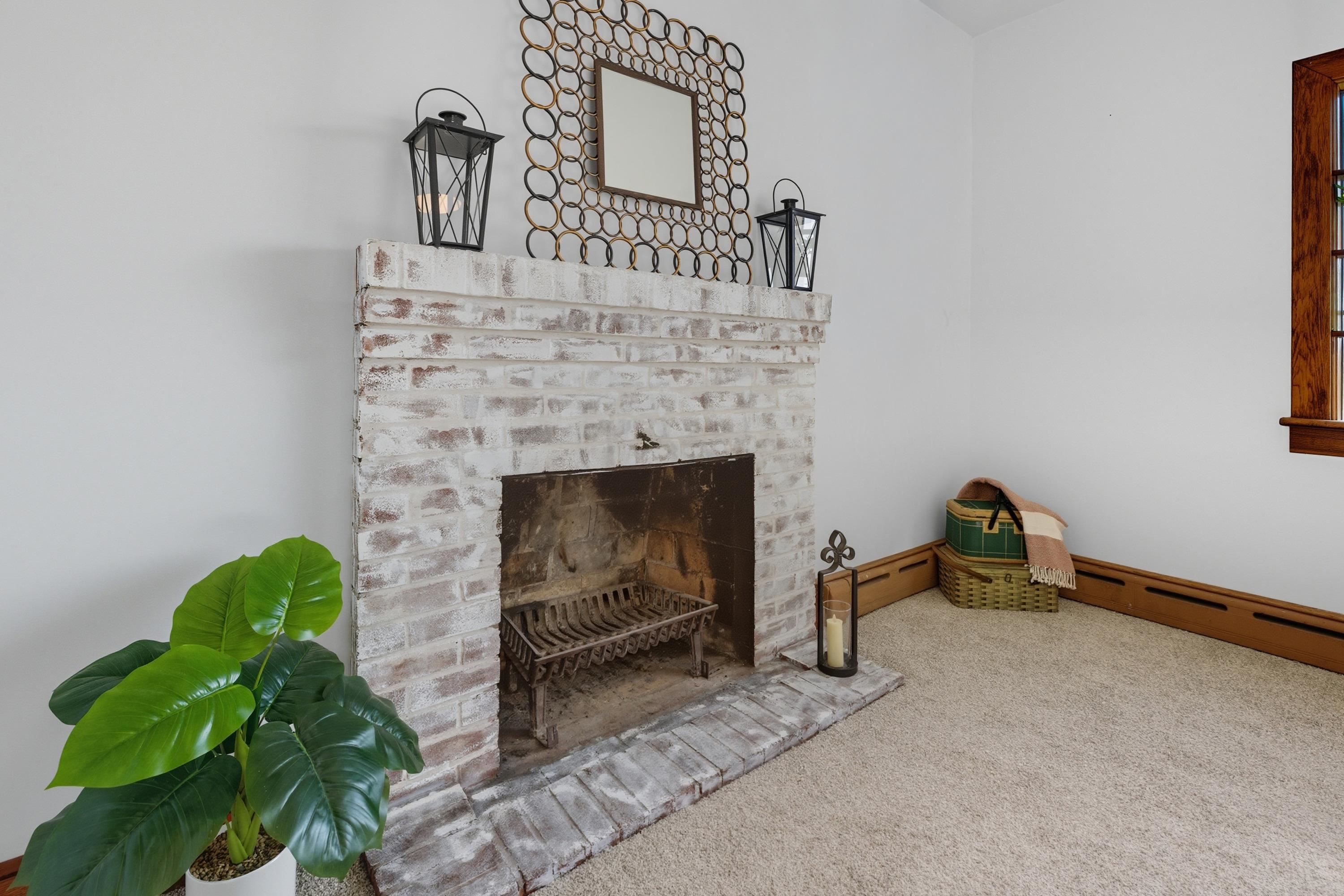 3138 Cross Keys Road Harrisonburg, VA 22801 - Photo 24 of 74 The living room space is located off the entrance to the home and near the steps leading to the upper level. This space features a fireplace, comfortable flooring, updated light fixture, and large windows allowing in an abundance of natural light!
