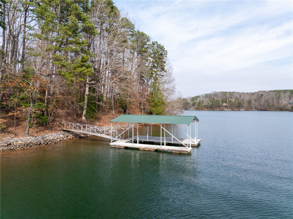 537 Peninsula Road West Union, SC 29696 - Photo 1 of 15 This tranquil waterfront setting features a private dock, offering serene lake access and picturesque views.