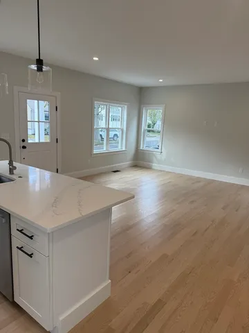 a view of a kitchen cabinets and wooden floor