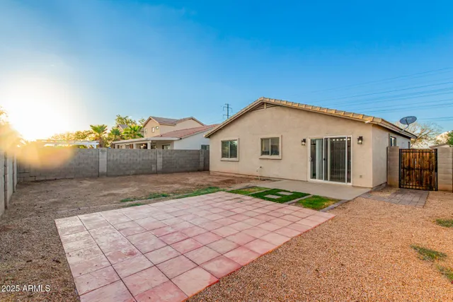 a view of a backyard of the house