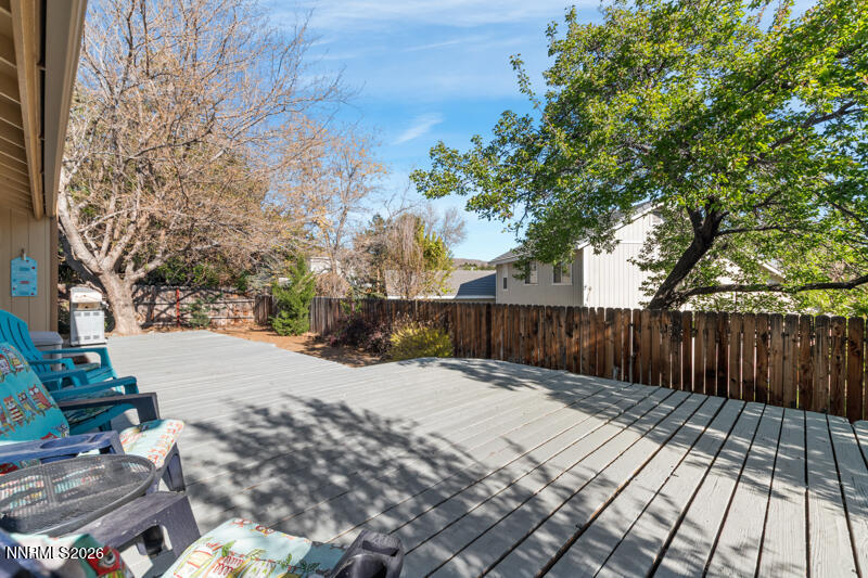 675 College Drive Reno, NV 89503 - Photo 26 of 30 a view of backyard with wooden fence and trees