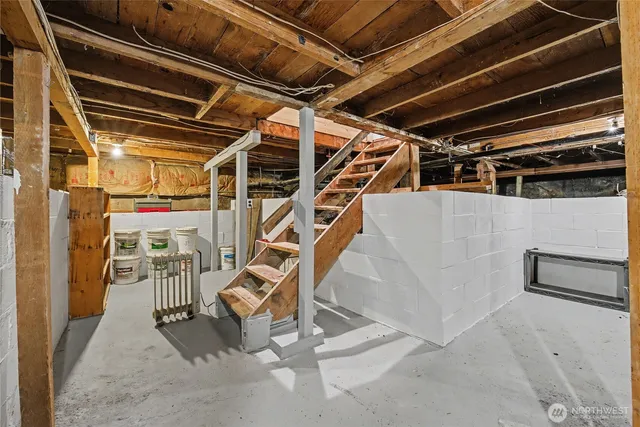 a view of an empty room with wooden walls