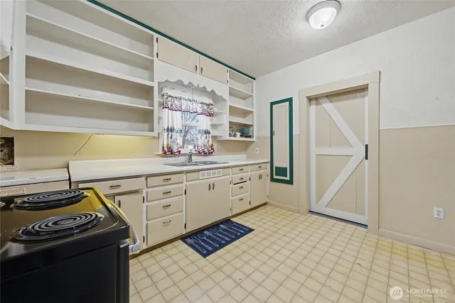 a kitchen with a cabinets and appliances