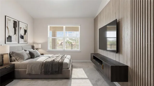 a bedroom with a bed and a window