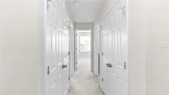a view of a hallway with windows