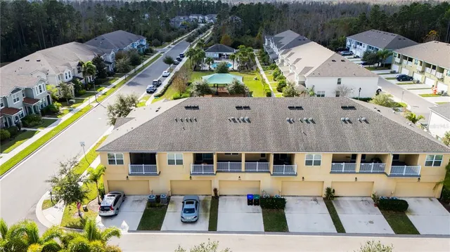 a aerial view of a house with a swimming pool