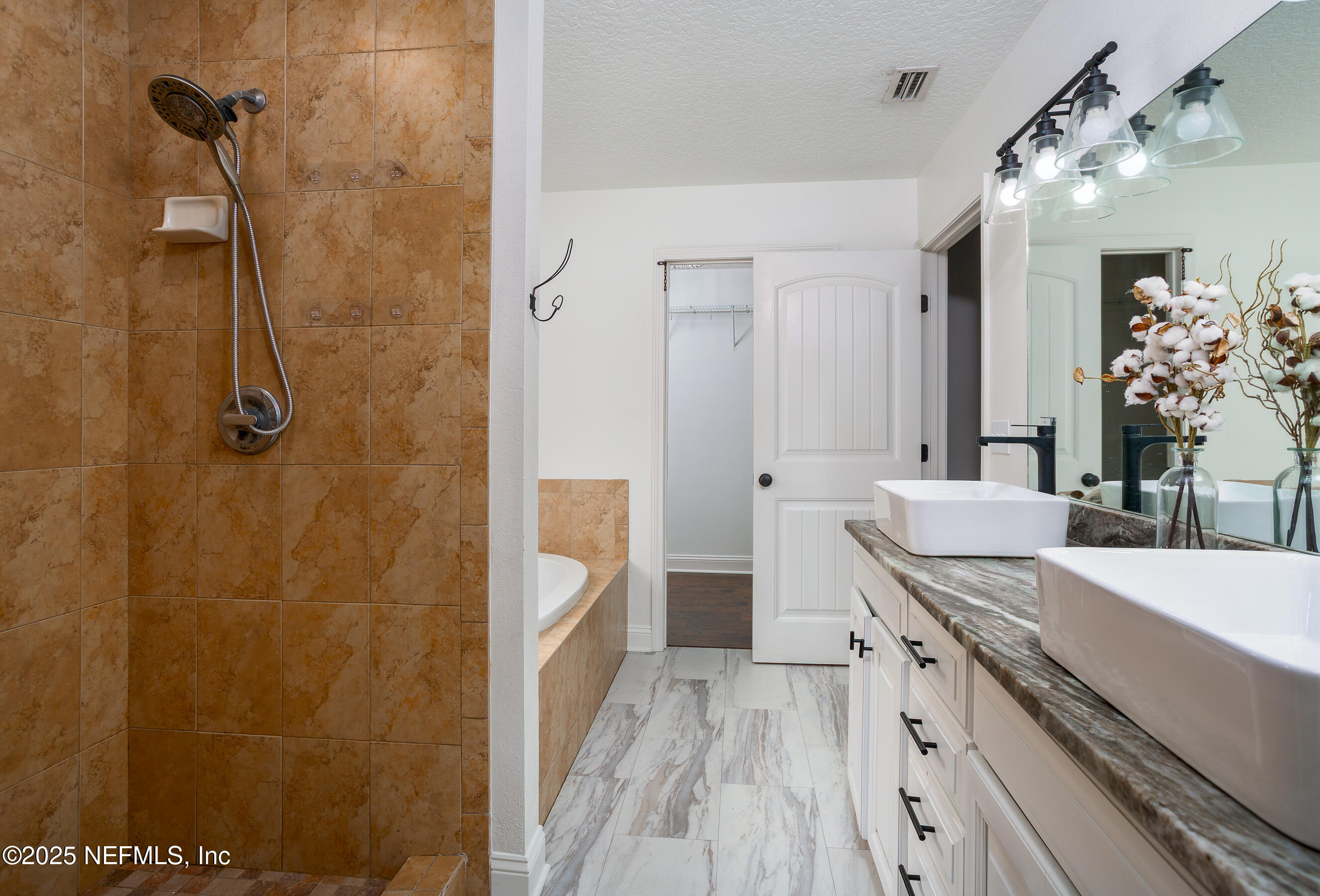 194 Horseman Club Road Palatka, FL 32177 - Photo 20 of 27 a bathroom with a granite countertop sink a mirror and a shower