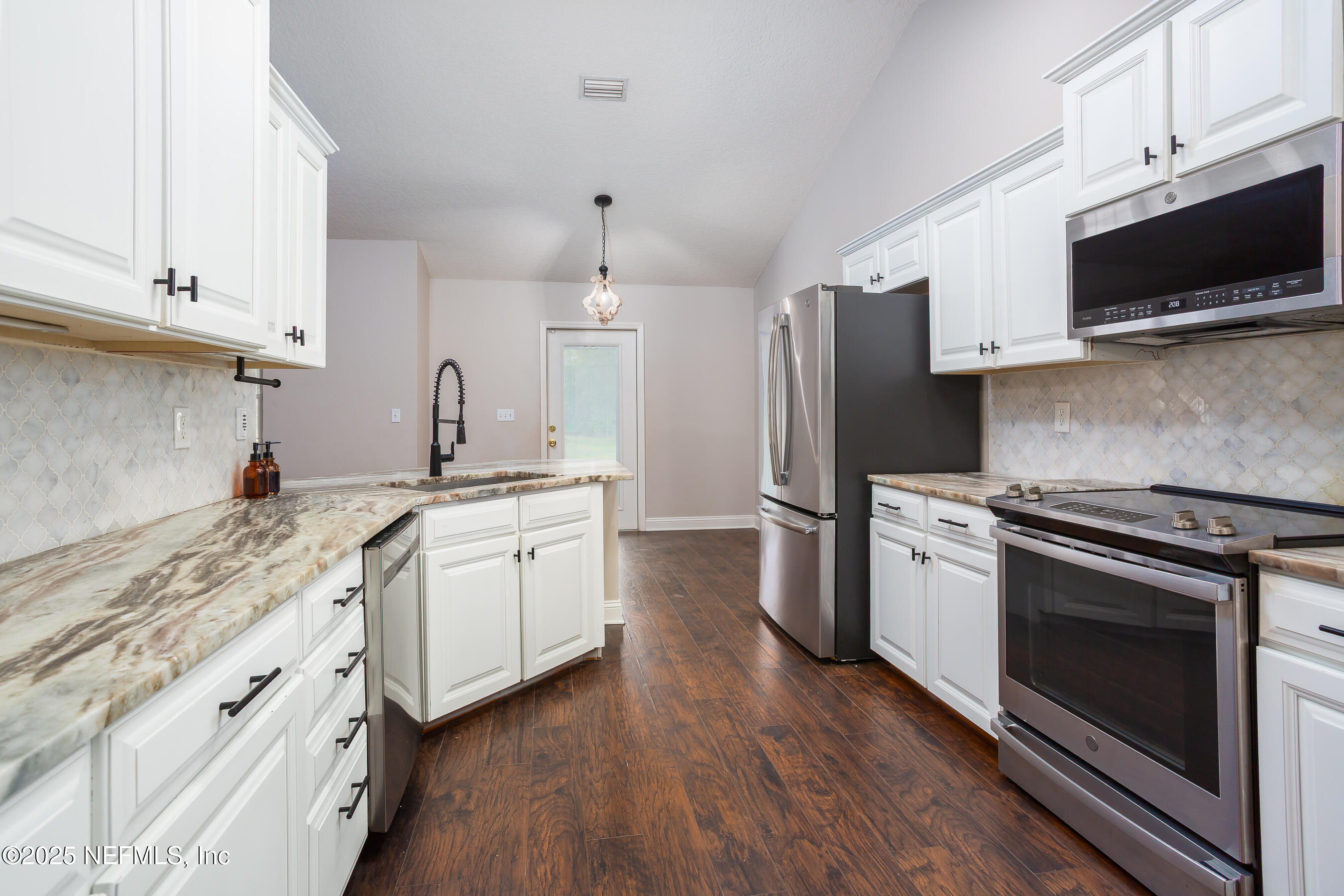 194 Horseman Club Road Palatka, FL 32177 - Photo 10 of 27 a kitchen with a sink stove and refrigerator