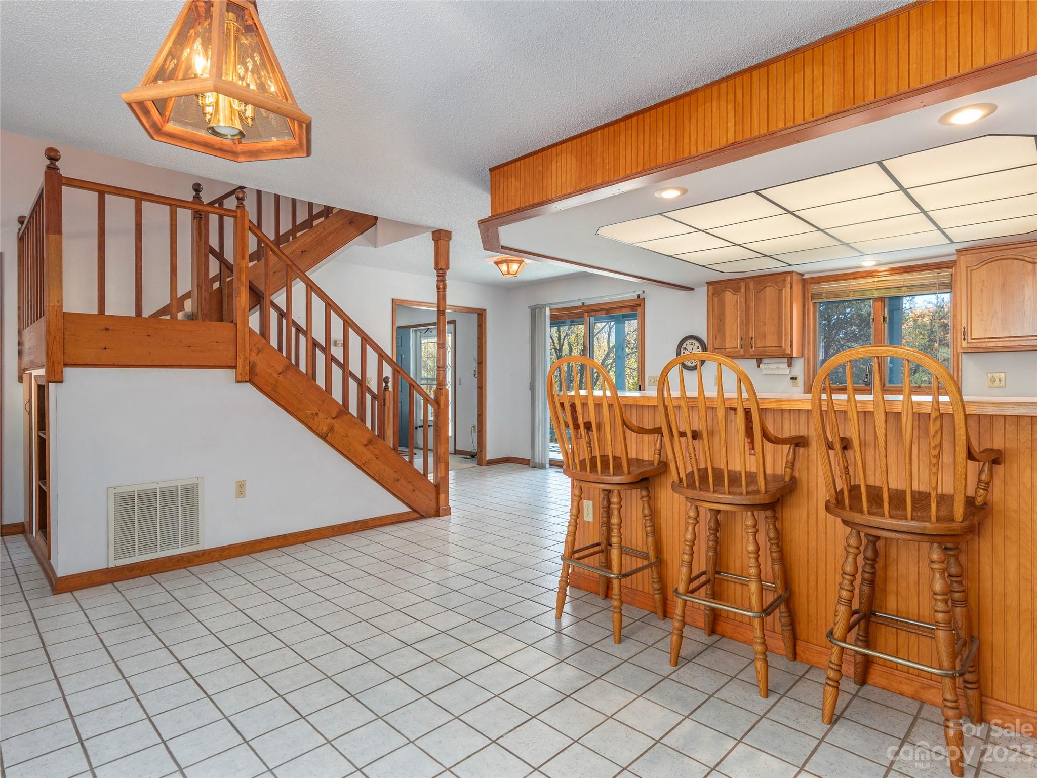 256 Goldfinch Lane Clyde, NC 28721 - Photo 11 of 31 a dining room with furniture and wooden floor