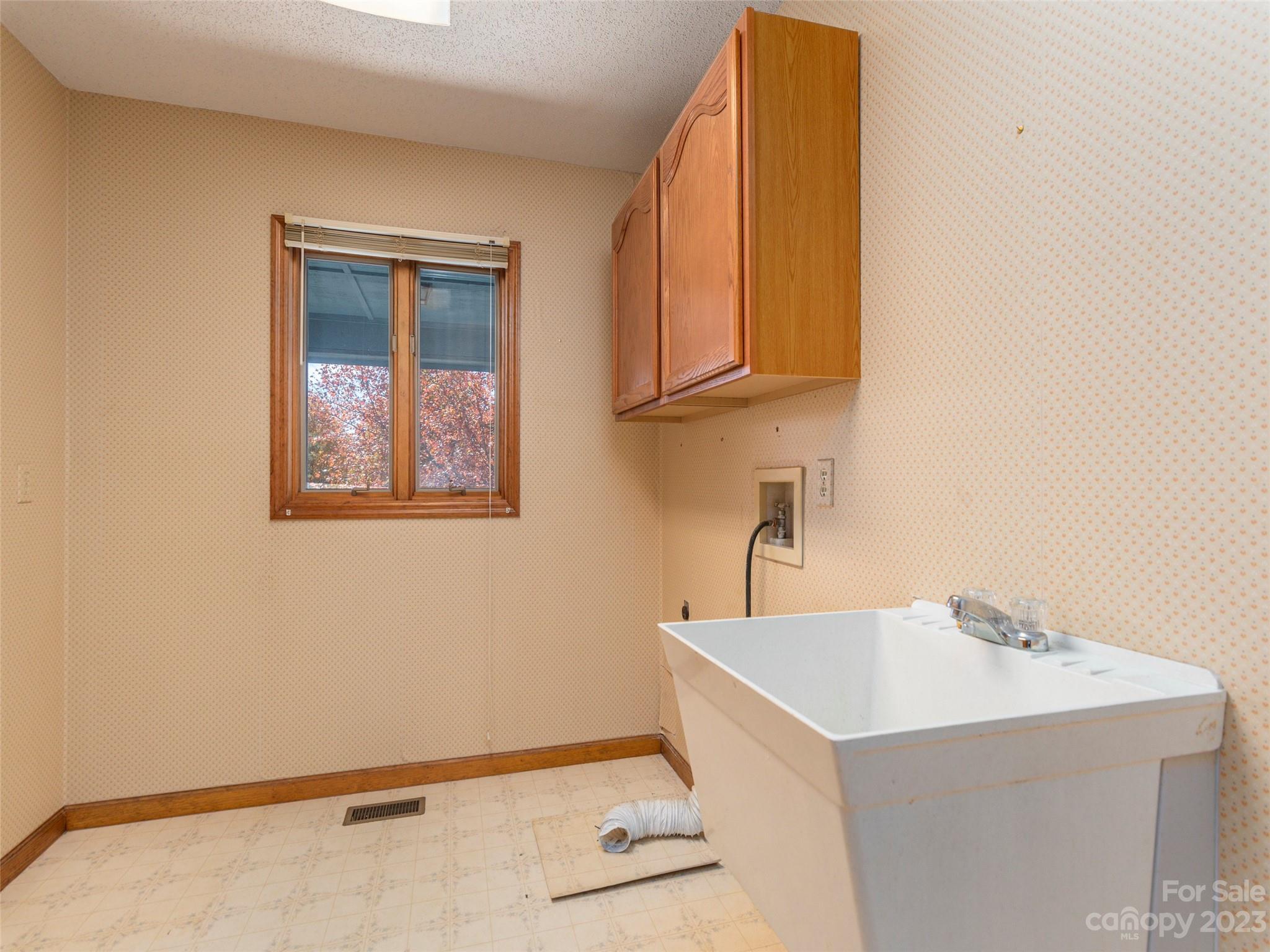 256 Goldfinch Lane Clyde, NC 28721 - Photo 14 of 31 a bathroom with a sink and a mirror