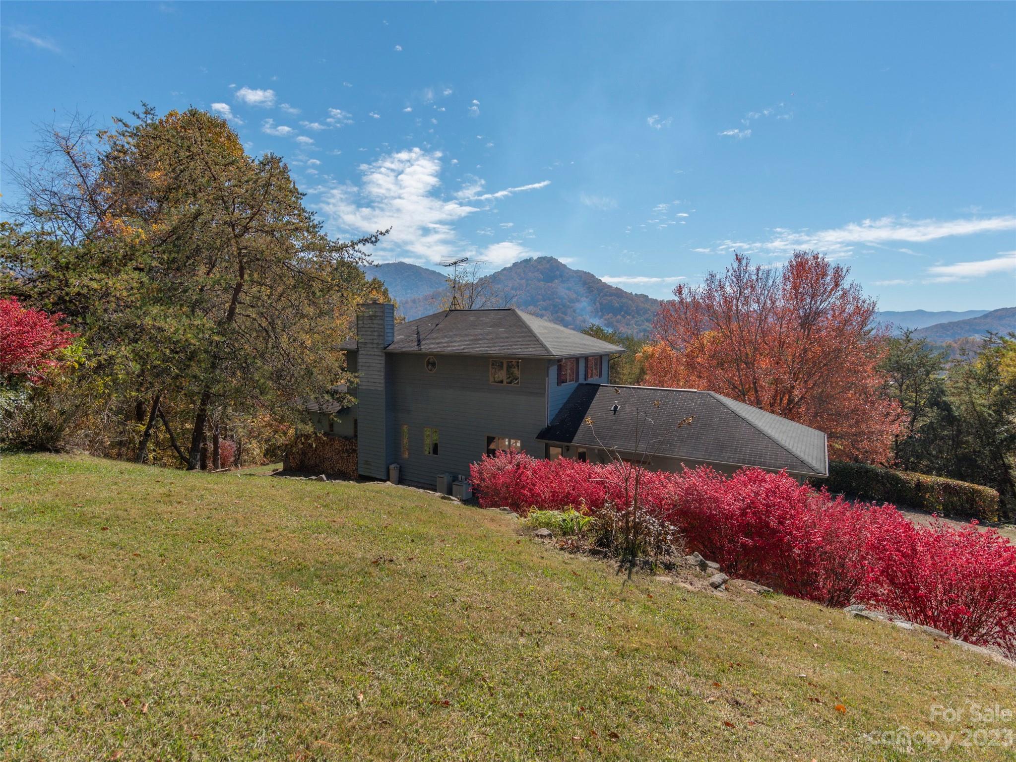 256 Goldfinch Lane Clyde, NC 28721 - Photo 27 of 31 a view of a house with a yard