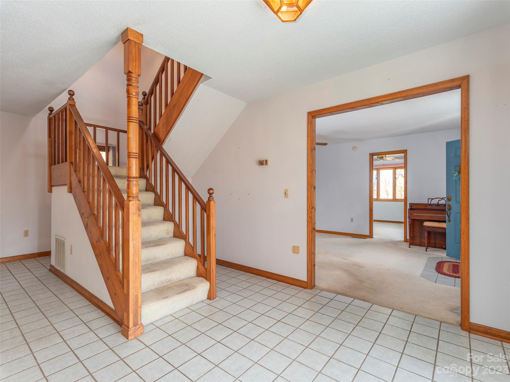 256 Goldfinch Lane Clyde, NC 28721 - Photo 7 of 31 a view of entryway with wooden floor and livingroom view