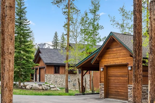 an aerial view of a house with a yard and garden