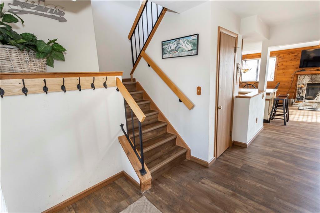 G11 Sunridge Road Champion, PA 15622 - Photo 13 of 30 a view of a hallway with wooden floor and staircase