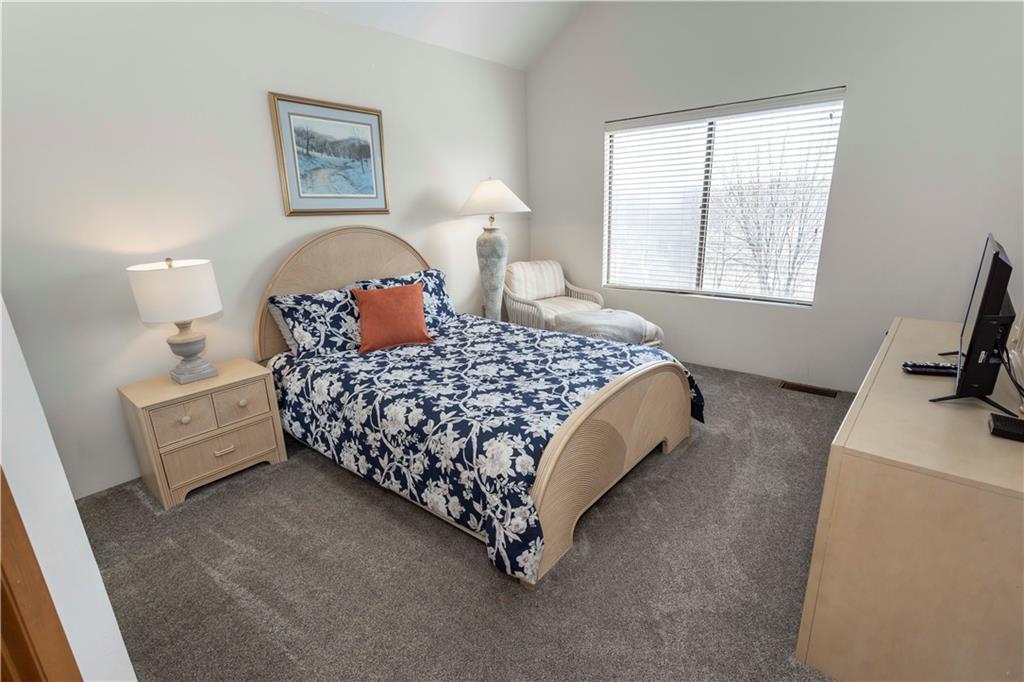 G11 Sunridge Road Champion, PA 15622 - Photo 18 of 30 a bedroom with a bed and dresser with mirror