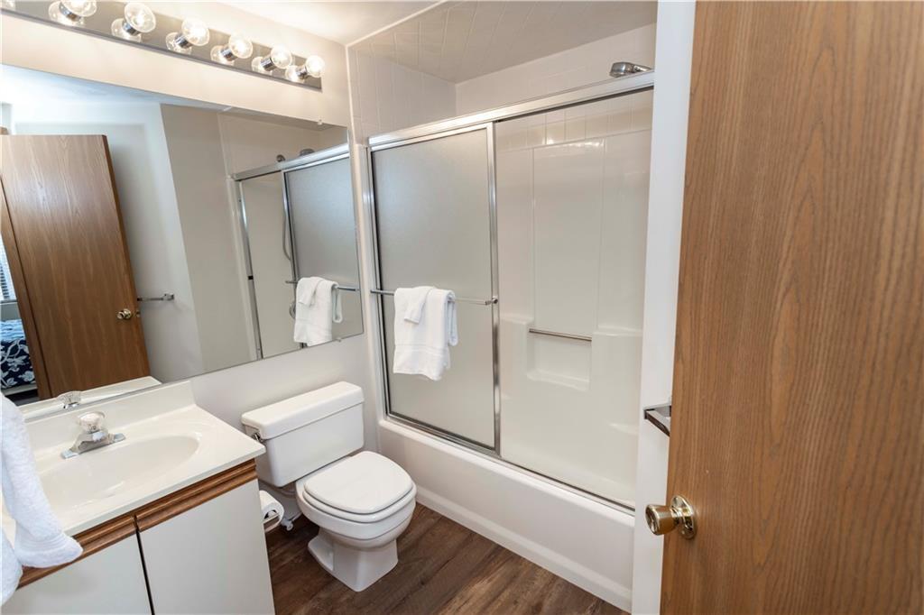 G11 Sunridge Road Champion, PA 15622 - Photo 21 of 30 a white toilet sitting next to a bathroom sink