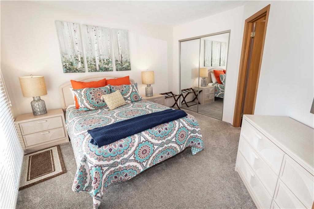 G11 Sunridge Road Champion, PA 15622 - Photo 22 of 30 a bedroom with a bed and a couch