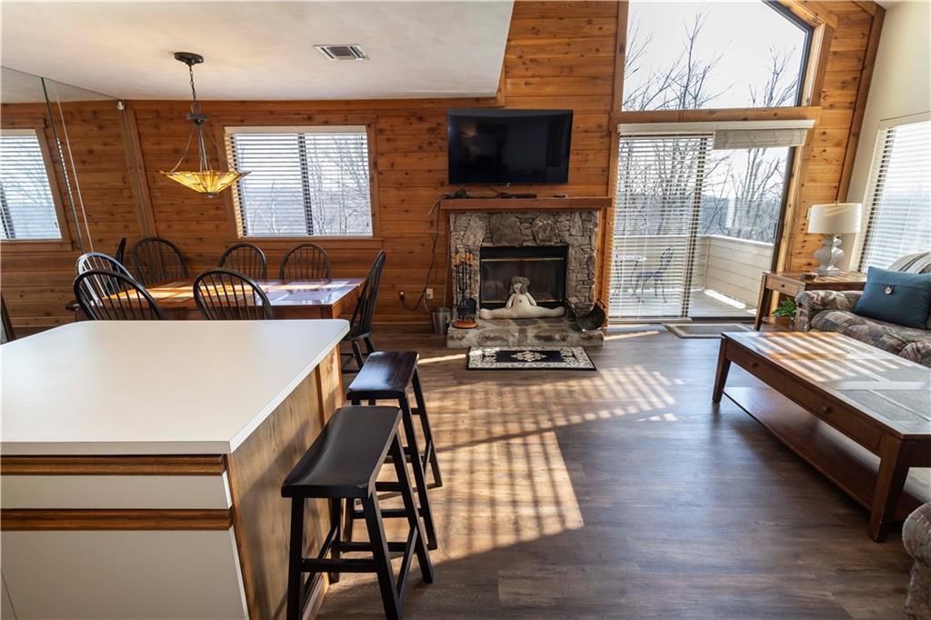 G11 Sunridge Road Champion, PA 15622 - Photo 8 of 30 a living room with furniture a flat screen tv and a fireplace