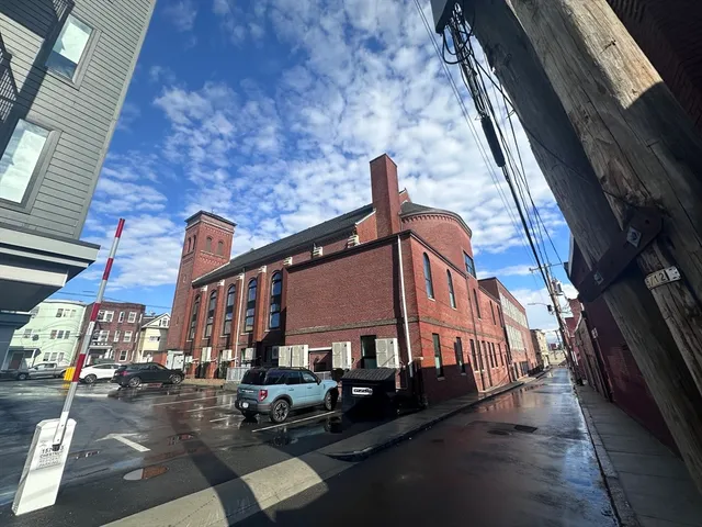 a view of a building with a street